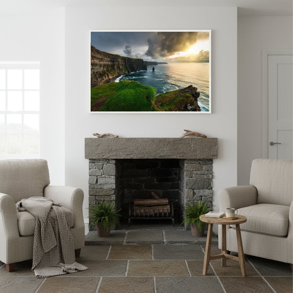 Large 60×90 cm framed Cliffs of Moher print above a limestone fireplace in an Irish coastal cottage with white walls, slate floors and linen armchairs.