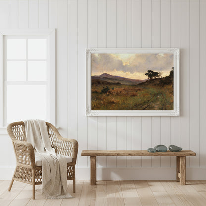 Coastal cottage interior; white shiplap wall, wicker armchair, wool throw; print in white frame hung above a driftwood bench; daylight from sash window.
