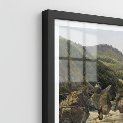 Close-up shot of the Murlough Bay and Fair Head print showing fine paper texture, sharp detail in rocks and waves, Black frame corner and shatterproof plexiglass edge, soft side lighting, archival feel