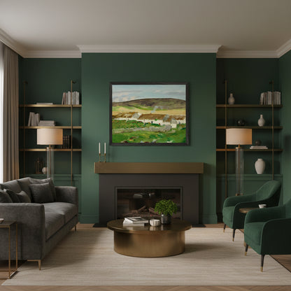Irish landscape print of white thatched cottages and green hills, unframed 40×50 cm archival matte paper. Black framed Irish landscape art print above a modern fireplace, deep green walls, brass accents, warm evening light, upscale contemporary Irish home.